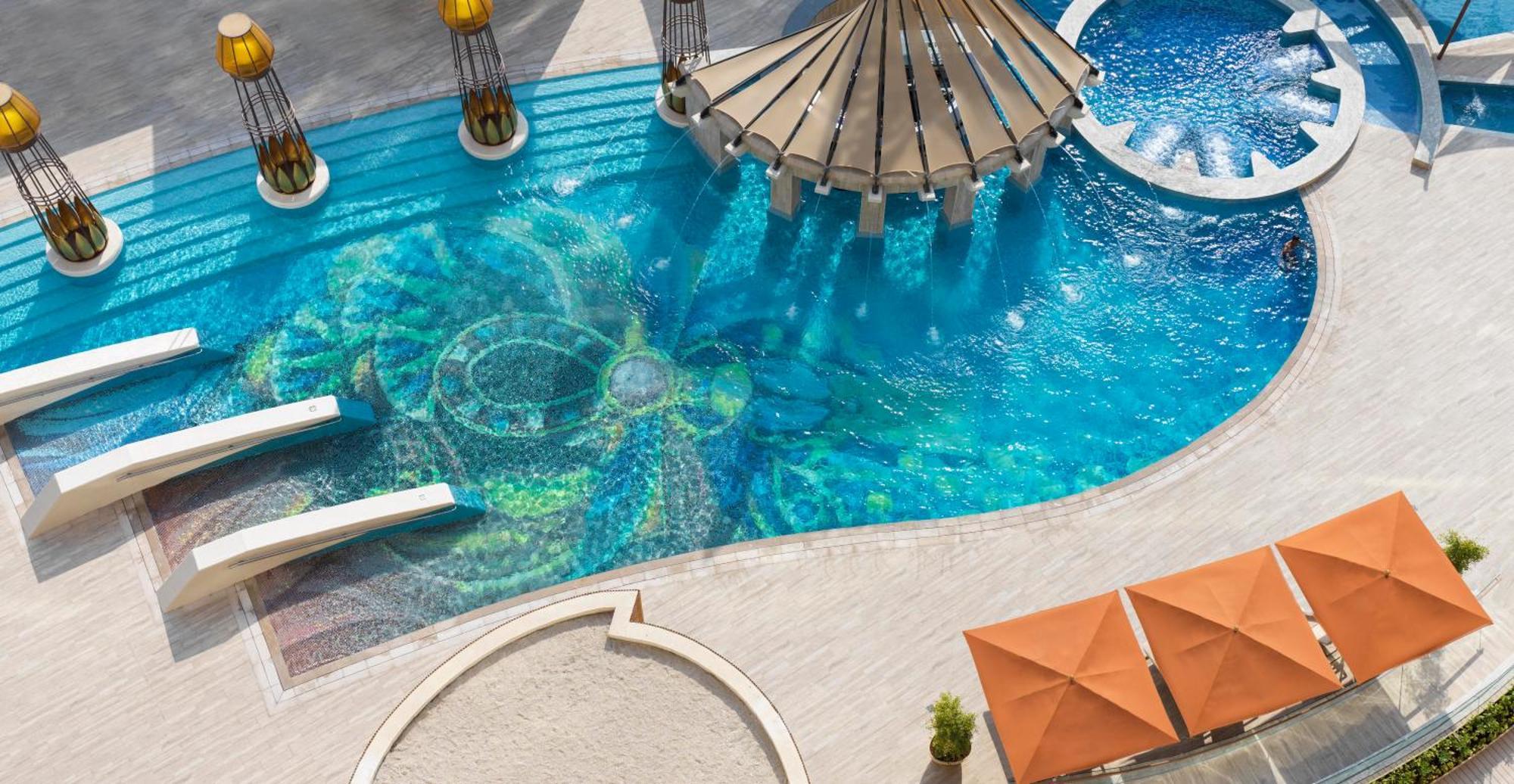 Hotel Raffles Dubai Esterno foto The swimming pool at the hotel